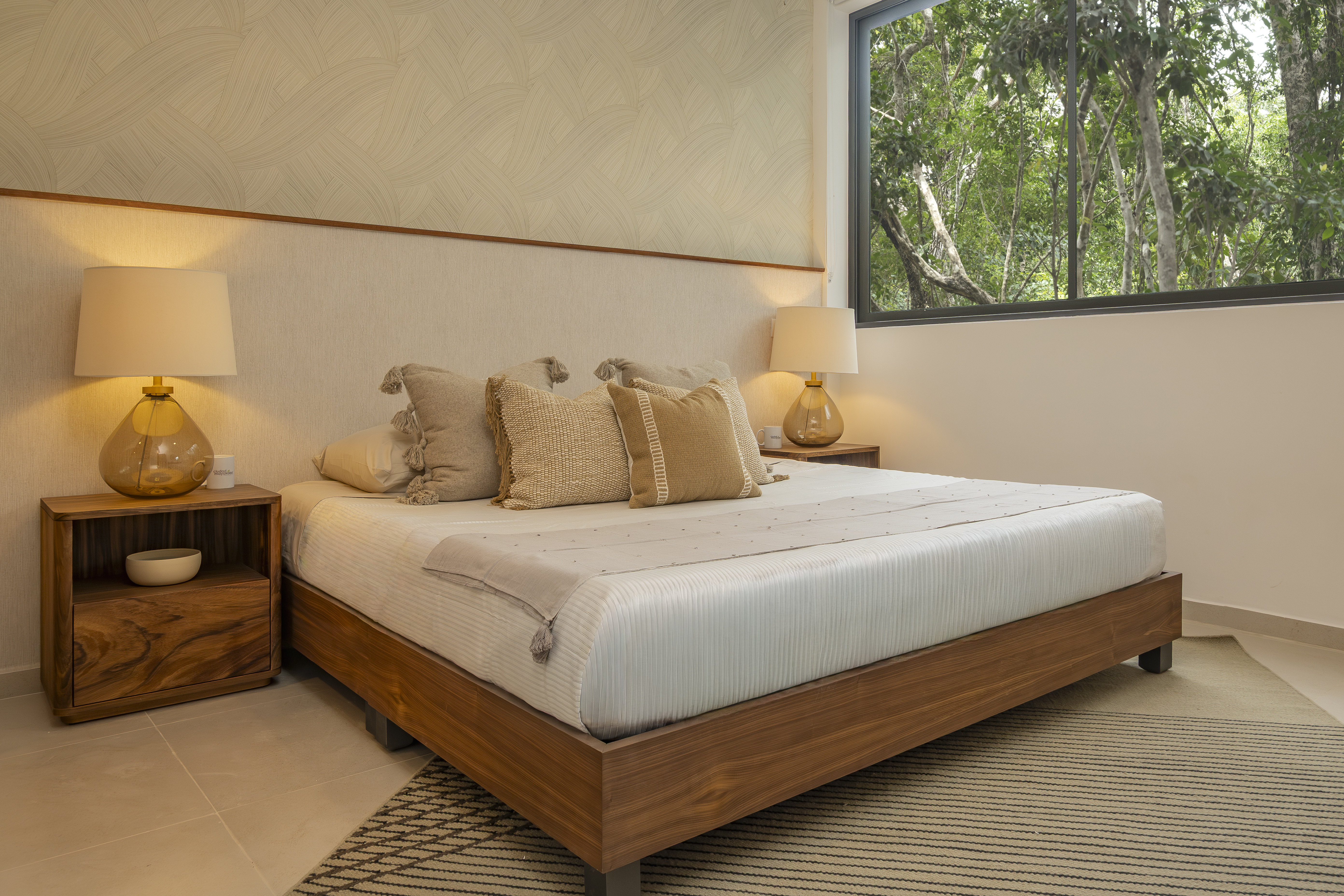 Bedroom at Bosques Roble overlooking neighboring Ciudad Mayakoba buildings
