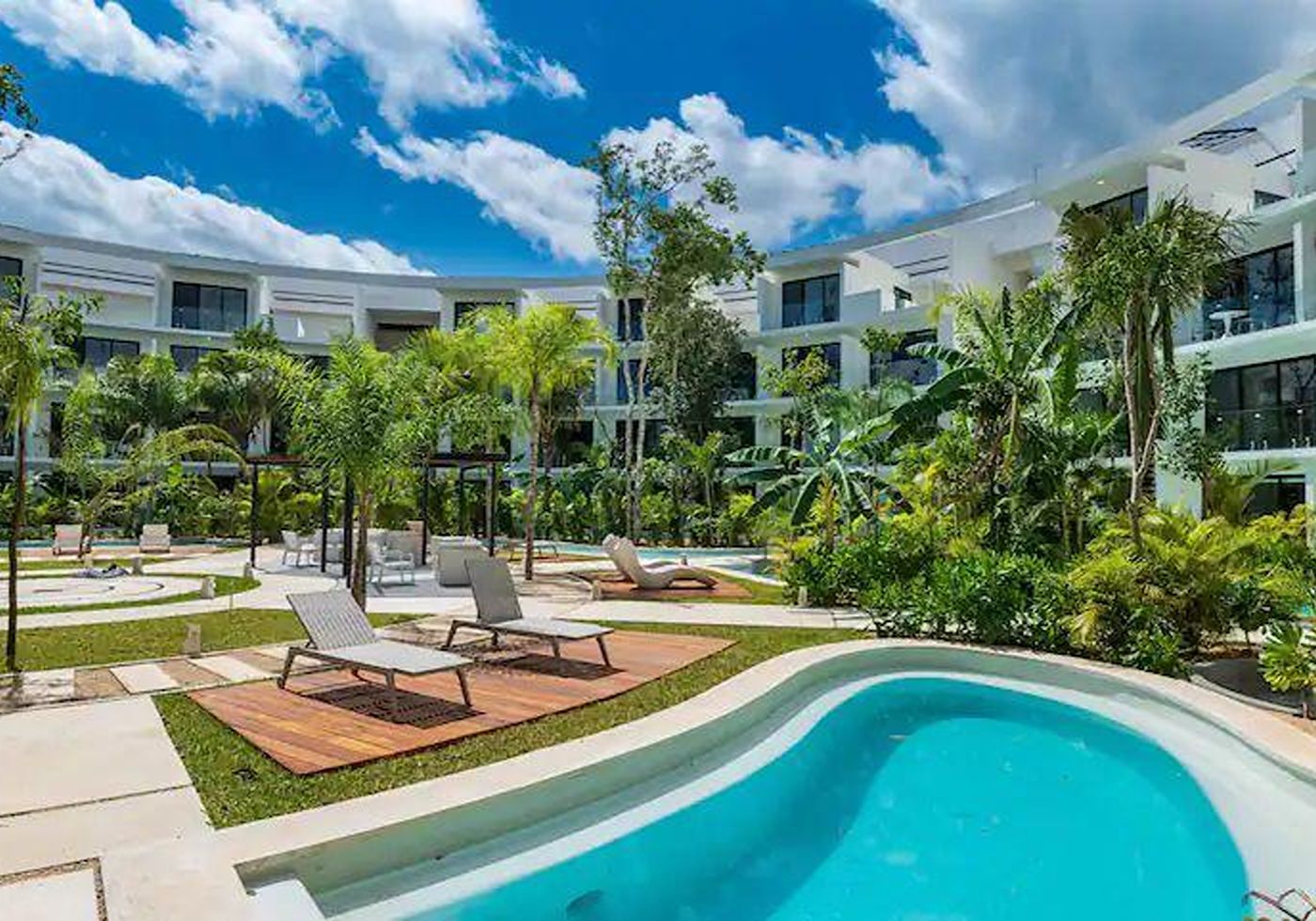 Pool and landscaped garden at Central Park Lagunas, another angle
