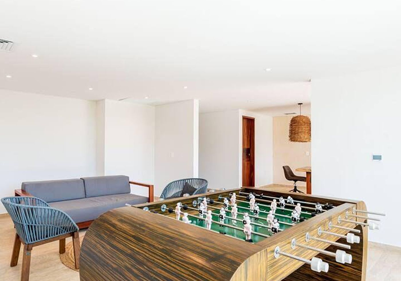 Shared games lounge at Central Park Lagunas with a foosball table