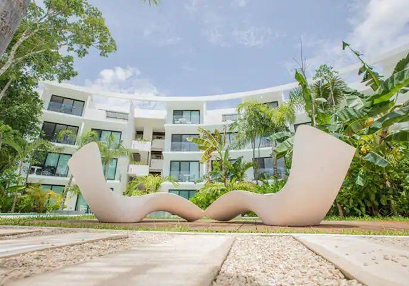 Central Park Lagunas, La Veleta, Tulum: the development’s central pool and curved building façade