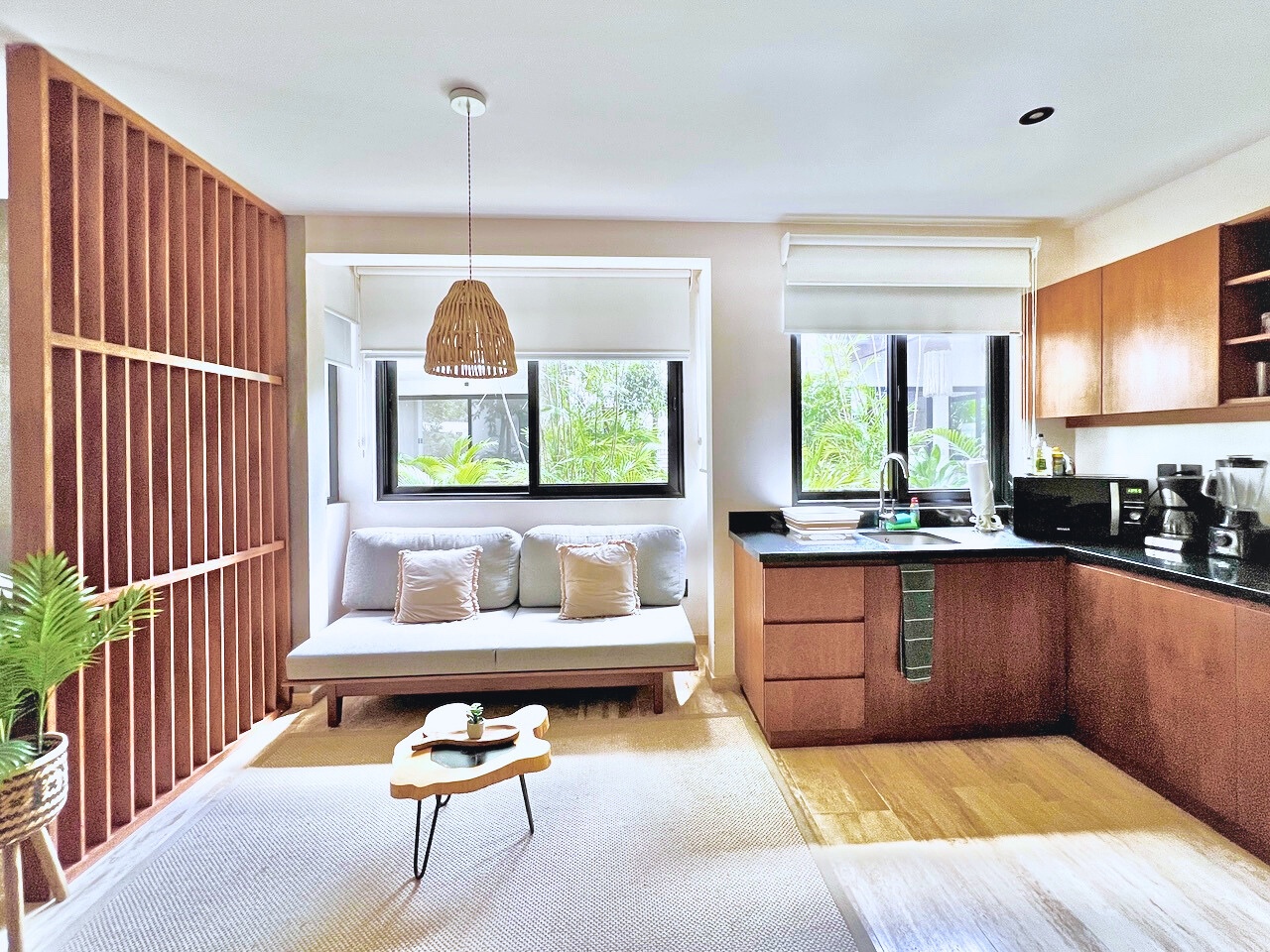 Living area and kitchenette of the developer’s Erena show unit, an open studio layout