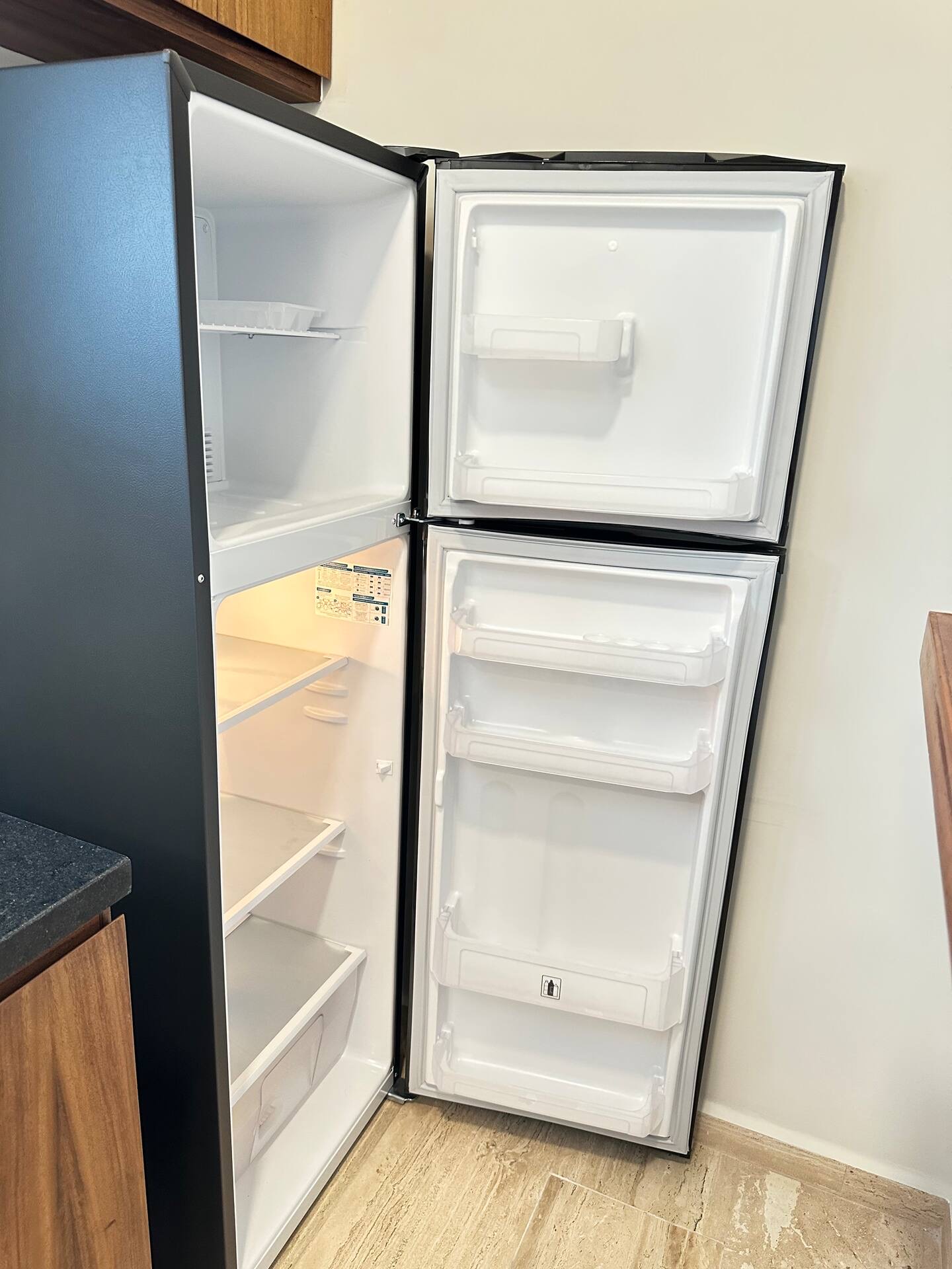 Kitchen refrigerator inside unit F303