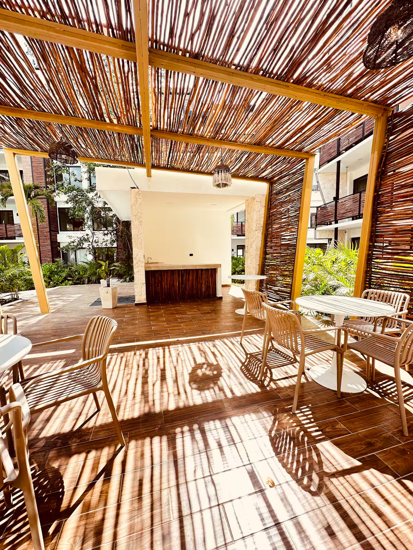 Palapa-roofed coworking and bar area at Naia Naay Village