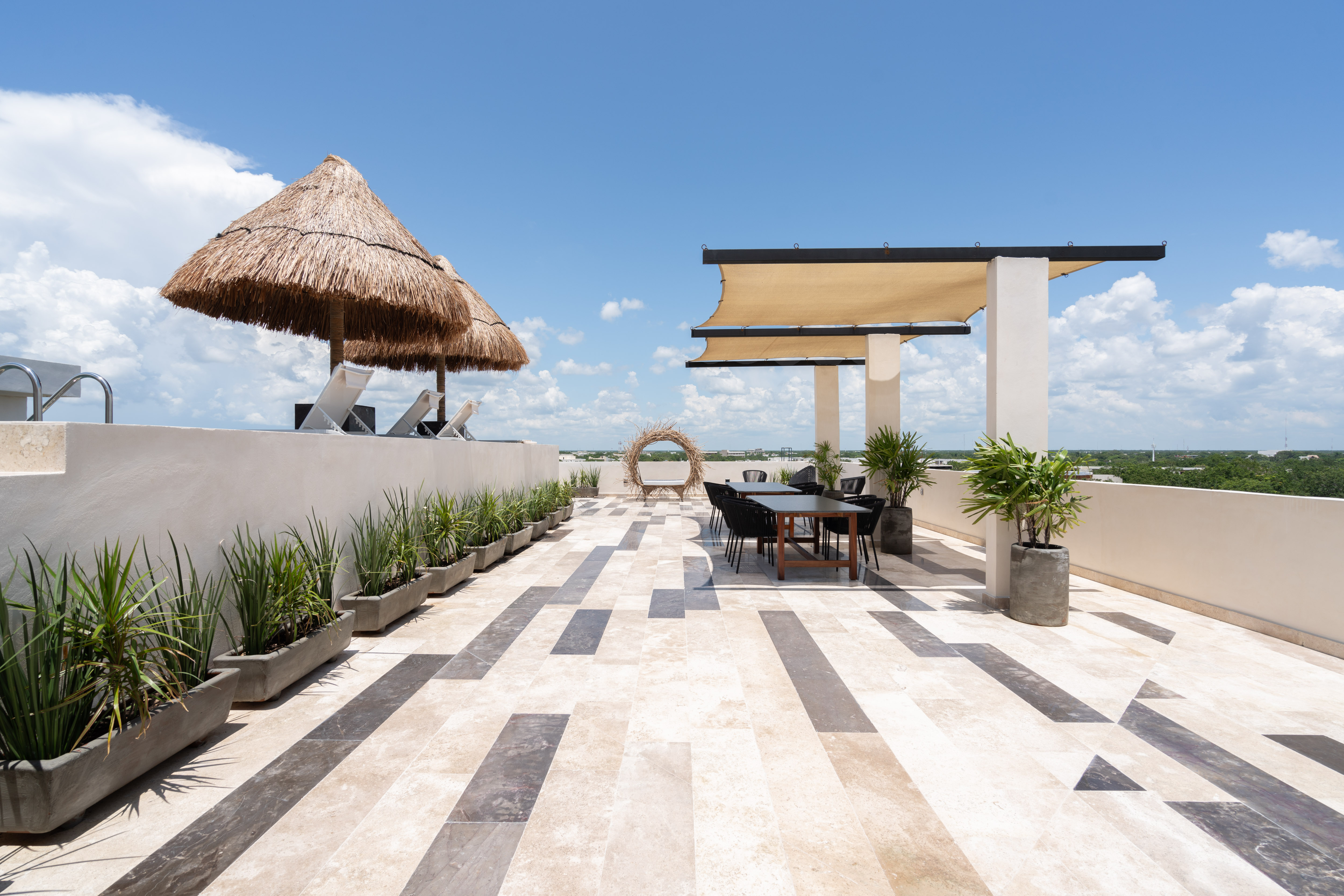 Rooftop palapa against the Tulum skyline
