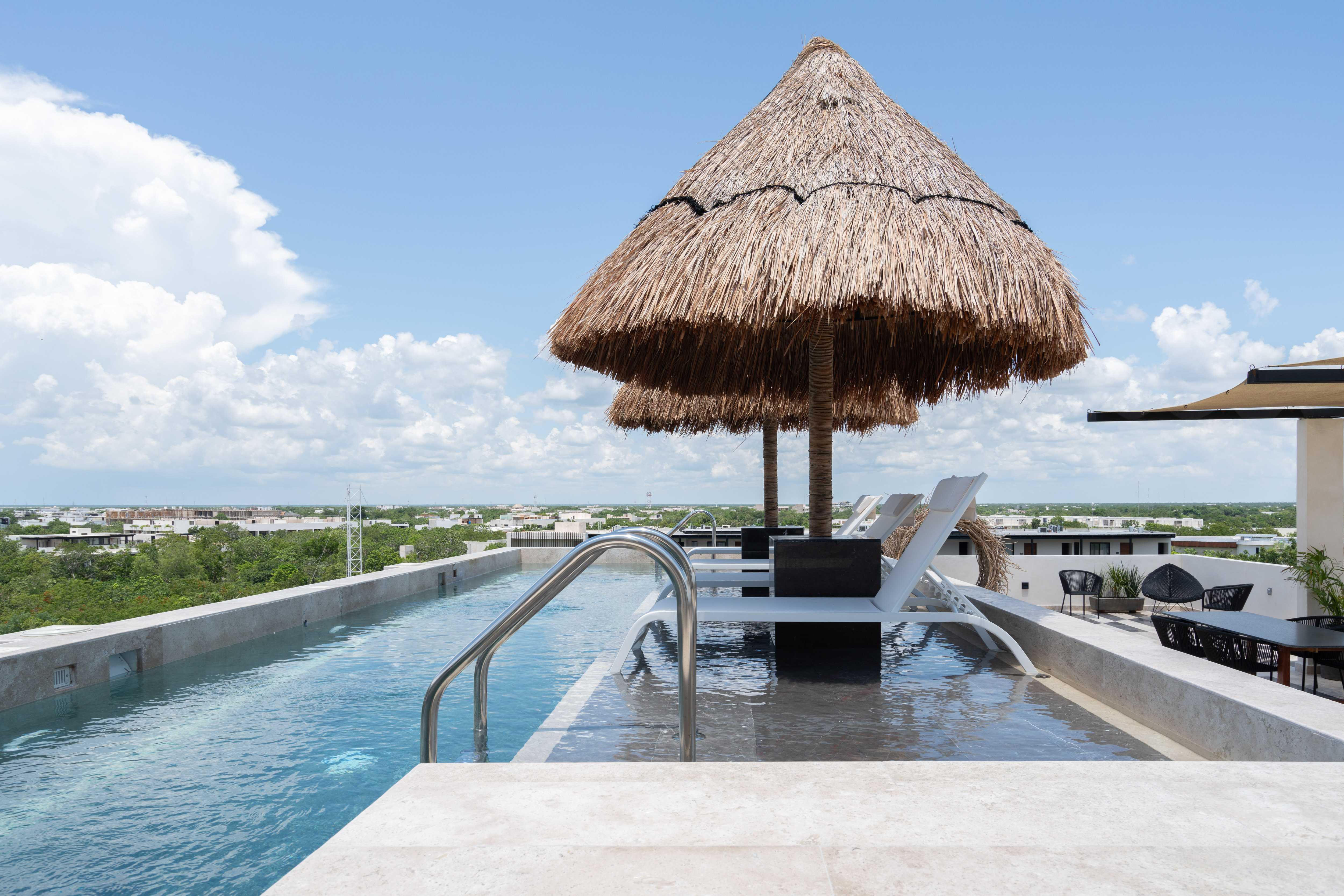 Narai's rooftop and ground-floor pools in Aldea Zamá, Tulum