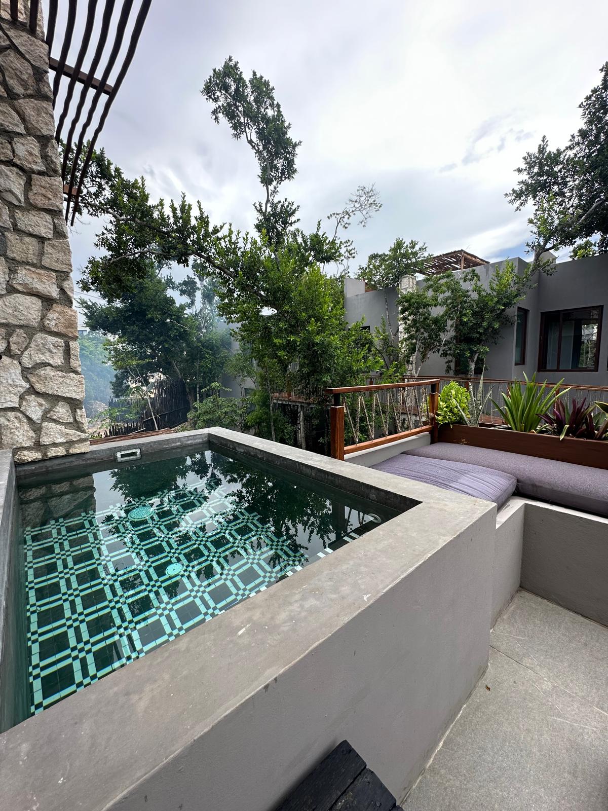Private plunge pool on B2-101’s lower terrace, with built-in bench seating