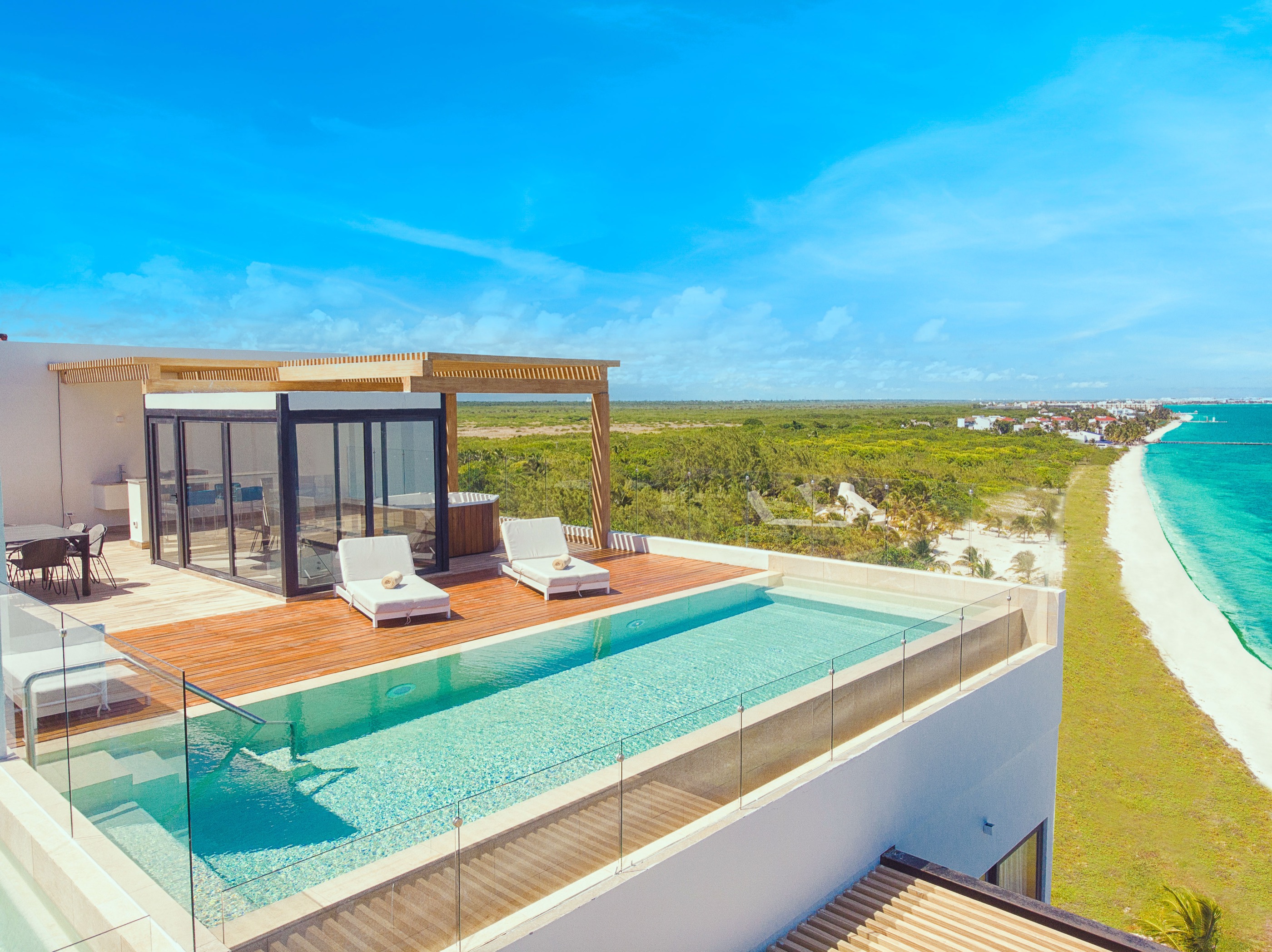 Oceanfront residence interior with infinity pool view at The Fives Oceanfront