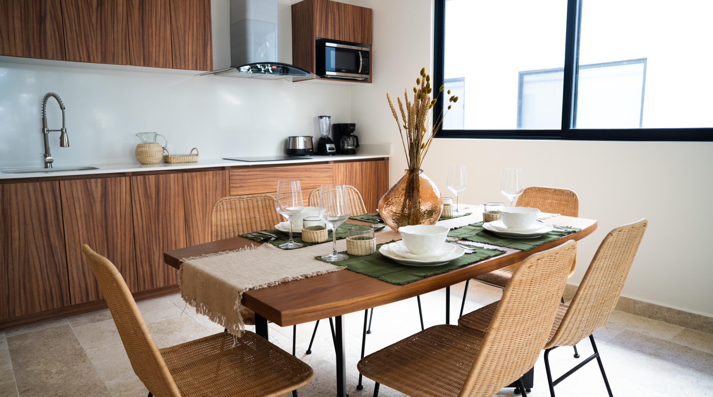 Furnished two-bedroom residence dining area set for guests