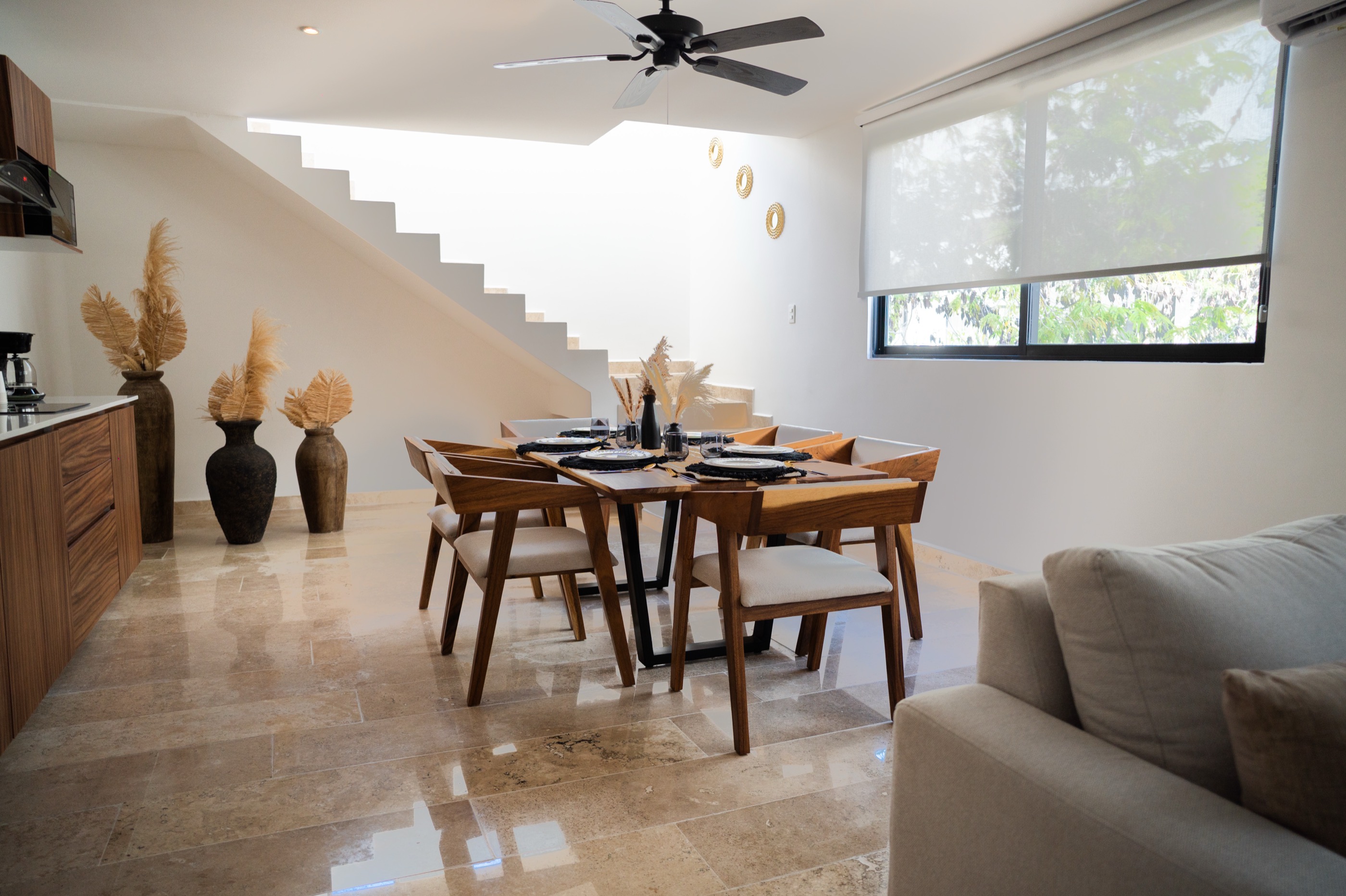 Double-height penthouse living and dining area at Town Center Zamá, furnished