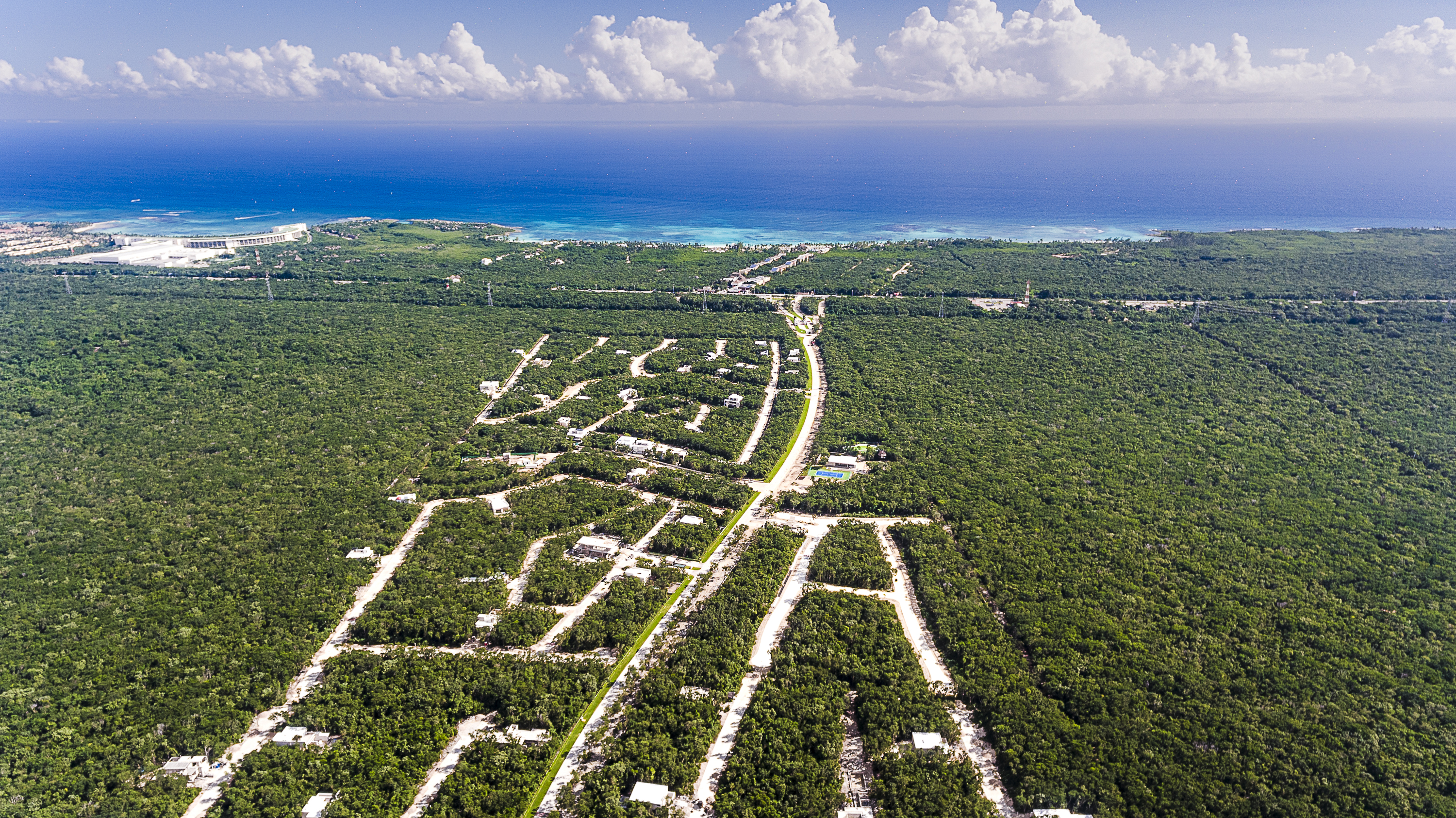 Aerial photograph of the subdivided lots with the Caribbean coastline in the background